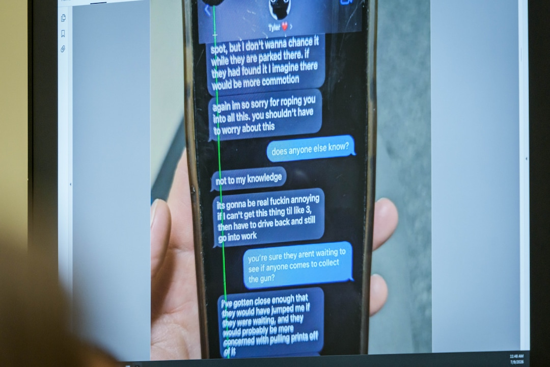 (Spenser Heaps | Pool) A photograph which prosecutors say shows a text message exchange between Tyler Robinson, who is accused in the fatal shooting of Charlie Kirk, and Robinson’s roommate and romantic partner Lance Twiggs, is shown during a preliminary hearing at the Fourth District Courthouse in Provo, Thursday, July 9, 2026.