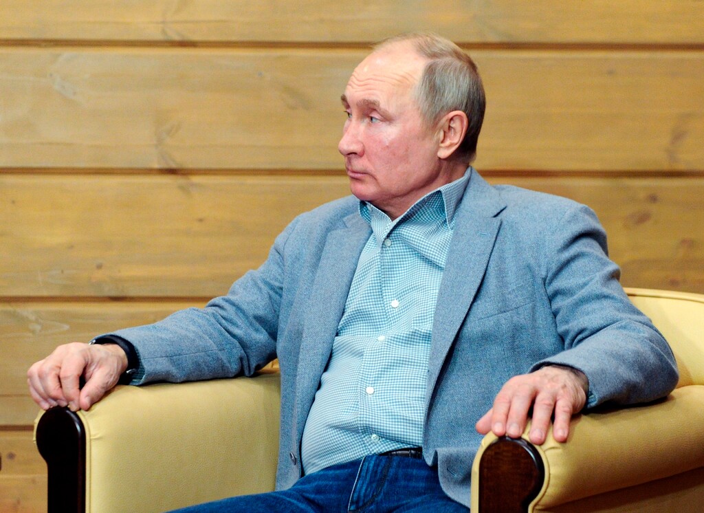 Russian President Vladimir Putin listens to Belarusian President Alexander Lukashenko during their meeting in the Black Sea resort of Sochi, Russia, Monday, Feb. 22, 2021. (Alexei Druzhinin, Sputnik, Kremlin Pool Photo via AP)