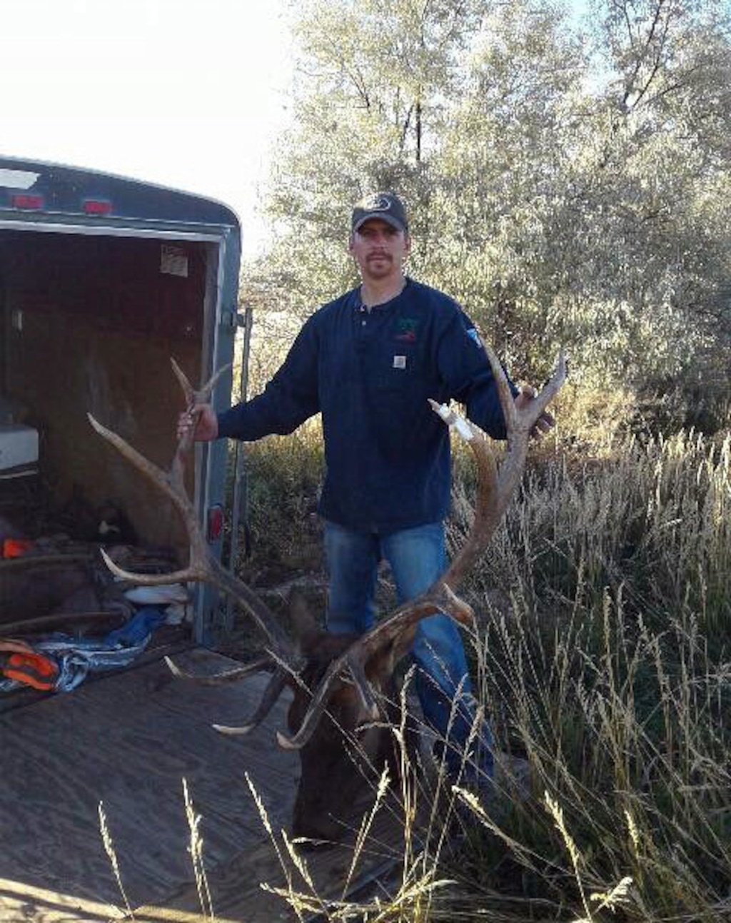 (Photo collected as evidence by the Utah Department of Wildlife Resources)  Kenneth Swenson Jr. shows the head and antlers of a bull elk he killed during a family poaching spree in fall 2016 in Duchesne, Uintah and Wasatch counties. He has pleaded guilty to a number of charges related to poaching and is serving a prison sentence for federal drug charges.