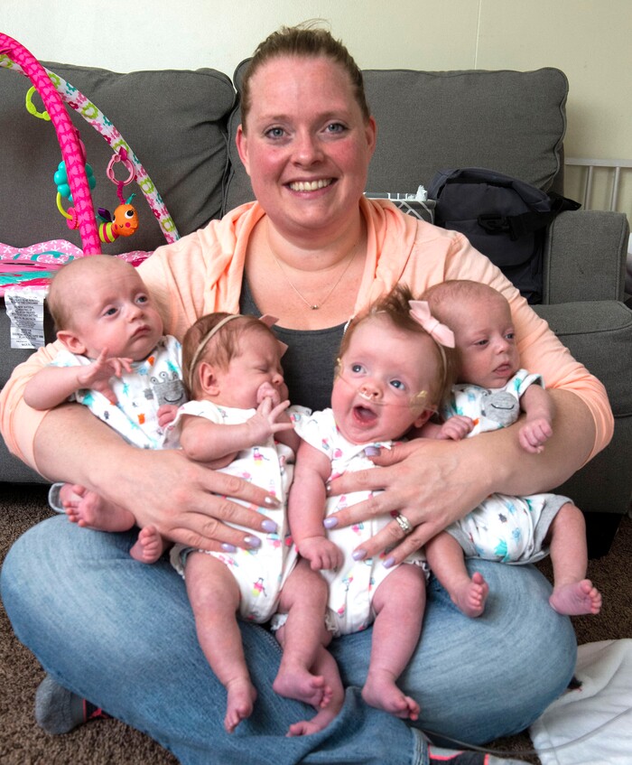 (Rick Egan  |  The Salt Lake Tribune)       Kayla Glines holds quadruplets, Reese, Lincoln, Oaklee and Jamesen at her home in Ogden, Saturday, June 15, 2019.