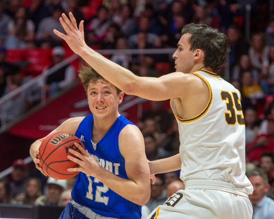 (Rick Egan  |  The Salt Lake Tribune)     Silverwolves Mitch Stratford (12) drives to the basket as Davis High forward Dylan Perrenoud (35)	defends, in the 6A championship game at the Jon M. Huntsman Center, Saturday Feb. 29, 2020