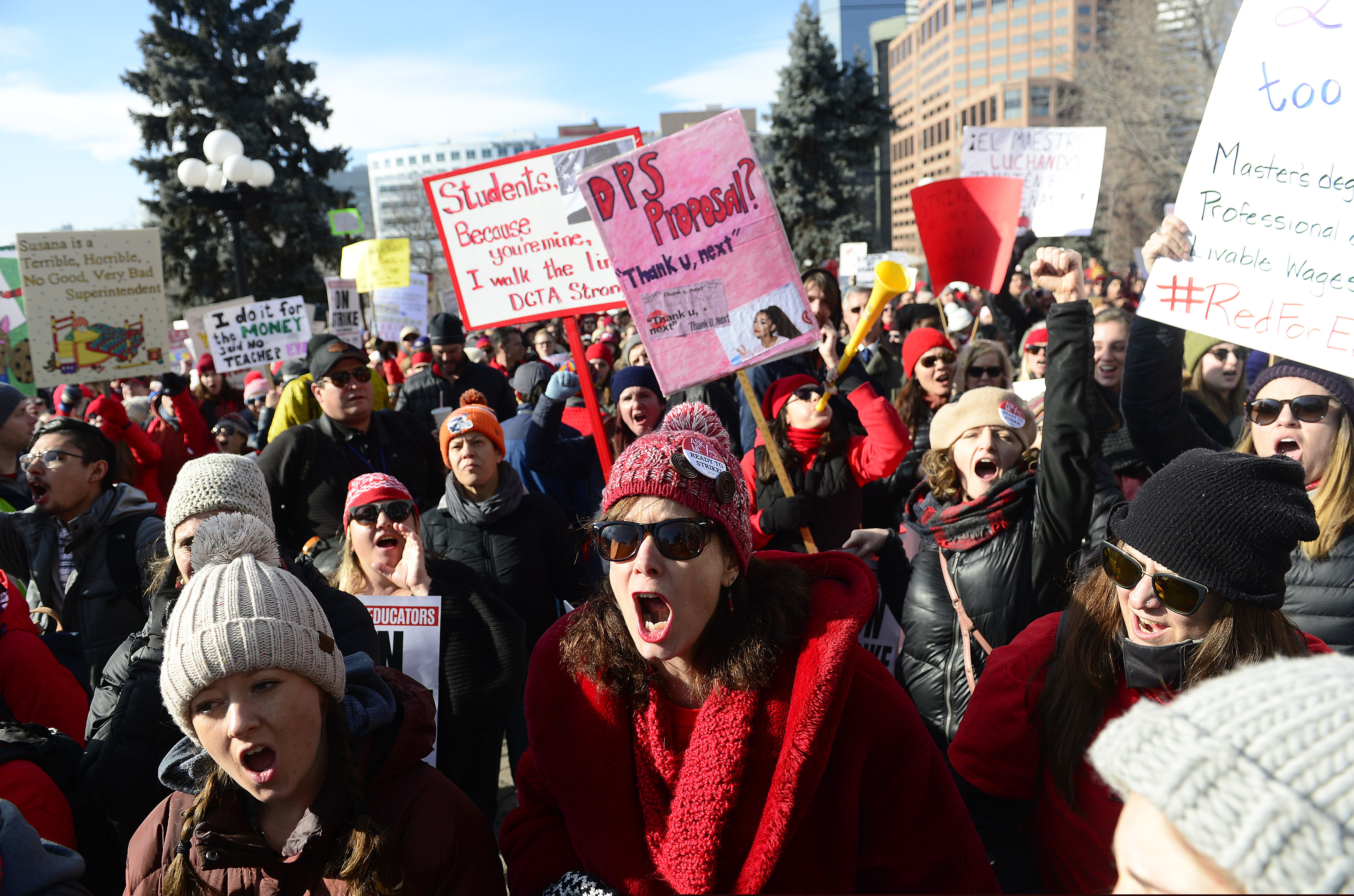 Lori Gates, center, a 3rd grade teacher from Park Hill elementary school, shouts with other teachers during a strike rally on the west steps of the state Capitol on the first day of the Denver Public Schools Teacher's strike, Monday, Feb. 11, 2019, in Denver. More negotiations are set for Tuesday. (Helen H. Richardson/The Denver Post via AP)