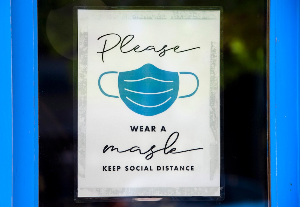 (Rick Egan  |  Tribune file photo)  A sign on the door of a store in downtown Salt Lake City, on Wednesday, July 29, 2020.