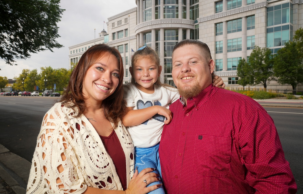 (Bethany Baker  |  The Salt Lake Tribune) From left, Anyssa Zancanella, Azaylee Zancanella-McMicheal, and Danniel McMicheal stand in front of the Matheson Courthouse in Salt Lake City on Wednesday, Aug. 27, 2025. In August, a judge ordered Steward Health Care to pay the family $951 million in damages for medical malpractice during Azaylee's birth.