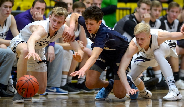 (Steve Griffin | The Salt Lake Tribune) Riverton's Richard Saunders, left, and Benjamin Nielson battle Westlake's Kekoa Baker for the ball during the 6A basketball playoff game against Riverton at the Utah Valley UniversityÕs UCCU Center in Provo Tuesday Feb. 27, 2018.