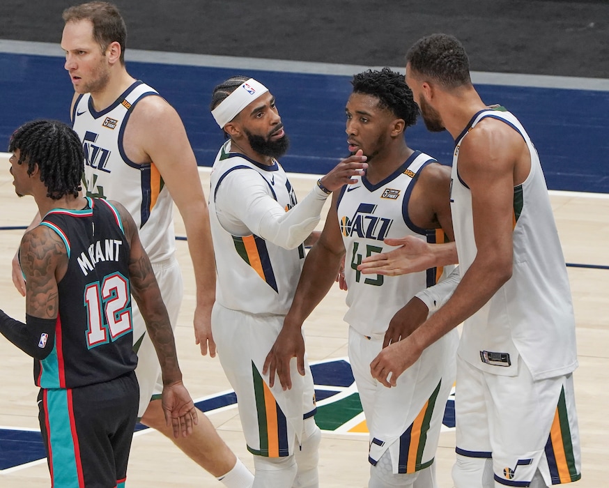 (Leah Hogsten | The Salt Lake Tribune) l-r Utah Jazz forward Bojan Bogdanovic (44), Utah Jazz guard Mike Conley (10)Utah Jazz guard Donovan Mitchell (45) and Utah Jazz center Rudy Gobert (27) celebrate play in the second half as the Utah Jazz host the Memphis Grizzlies, Mar. 26, 2021 at Vivint Arena.
