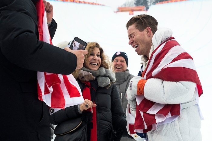 (Chris Detrick  |  The Salt Lake Tribune)  Shaun White reacts to seeing his friends and family after winning gold after his run during the men's halfpipe finals at Phoenix Snow Park during the Pyeongchang 2018 Winter Olympics Wednesday, Feb. 14, 2018.  White won the event with a 97.75, his third Olympic gold medal in the halfpipe (2006, 2010, 2018).