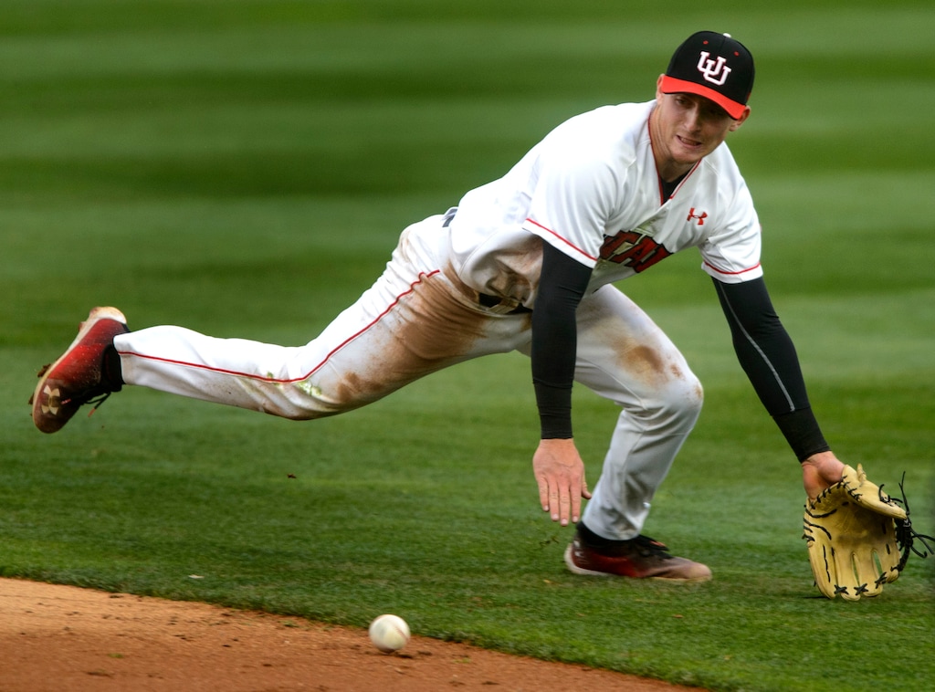 (Steve Griffin  |  The Salt Lake Tribune file photo)  Utah second baseman Oliver Dunn dives for a ball during the BYU versus Utah baseball game at Smiths Ballpark in Salt Lake City Tuesday April 3, 2018.