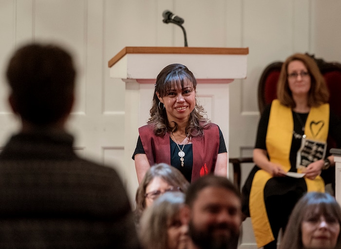 (Michael Mangum  |  Special to the Tribune)

Members of the congregation give Vicky Chavez, center, their well wishes, as Rev. Monica Dobbins, right, listens during a vigil held at First Unitarian Church in Salt Lake City, UT on Wednesday, January 30th, 2019. The vigil marked the one-year anniversary of when Chavez came to the church with her children seeking sanctuary from deportation.