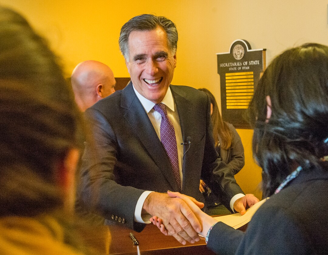 (Rick Egan  |  The Salt Lake Tribune)    Mitt Romney jokes with Election Specialists, Lauren Shafer and Lauren Wilko, as he files to run for the United States Senate, in the Lt. Governor's office at the State Capitol, Thursday, March 15, 2018.