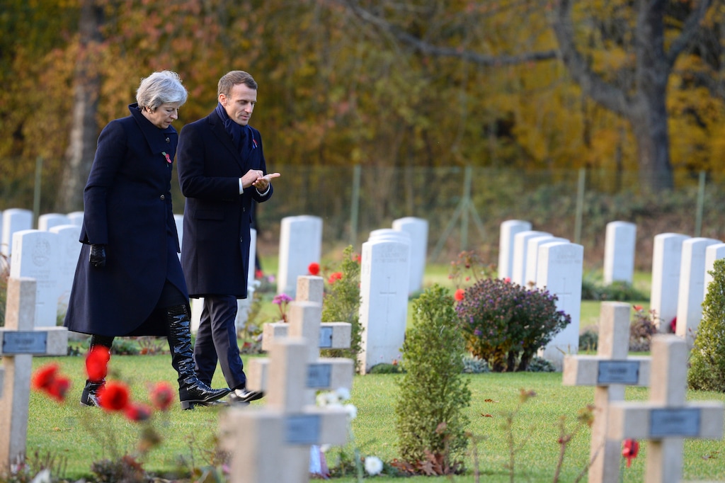 (Eliot Blondet/Pool Photo via AP) British Prime Minister Theresa May and French President Emmanuel Macron visit the Thiepval cemetery as part of ceremonies to mark the centenary of the 1918 Armistice, in Thiepval, northern France, Friday, Nov. 9, 2018. The memorial commemorates more than 72,000 men of British and South African forces who died in the Somme offensive of 1916.