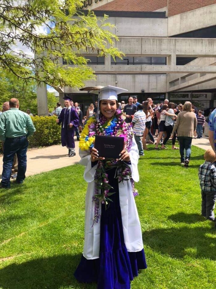 (Photo courtesy of Tasheena Savala) Pictured is Tasheena Savala with leis and decorations added after her graduation ceremony on May 29, 2019.
