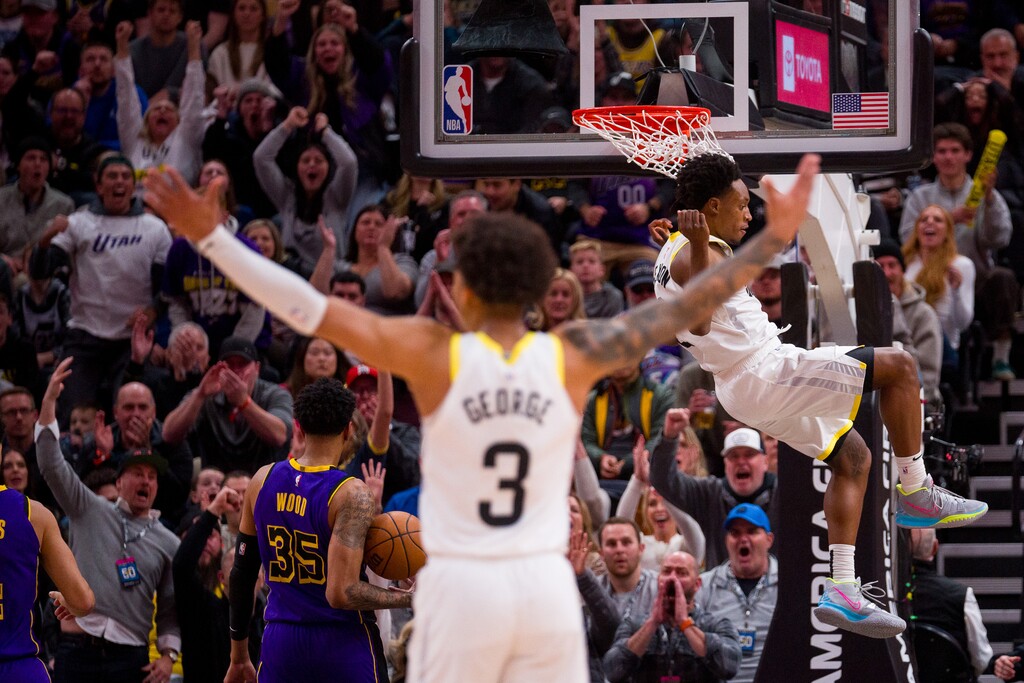 (Trent Nelson | The Salt Lake Tribune) Utah Jazz guard Keyonte George (3) celebrates as Utah Jazz guard Collin Sexton (2) dunks the ball late in the fourth quarter as the Utah Jazz host the Los Angeles Lakers, NBA basketball in Salt Lake City on Saturday, Jan. 13, 2024.