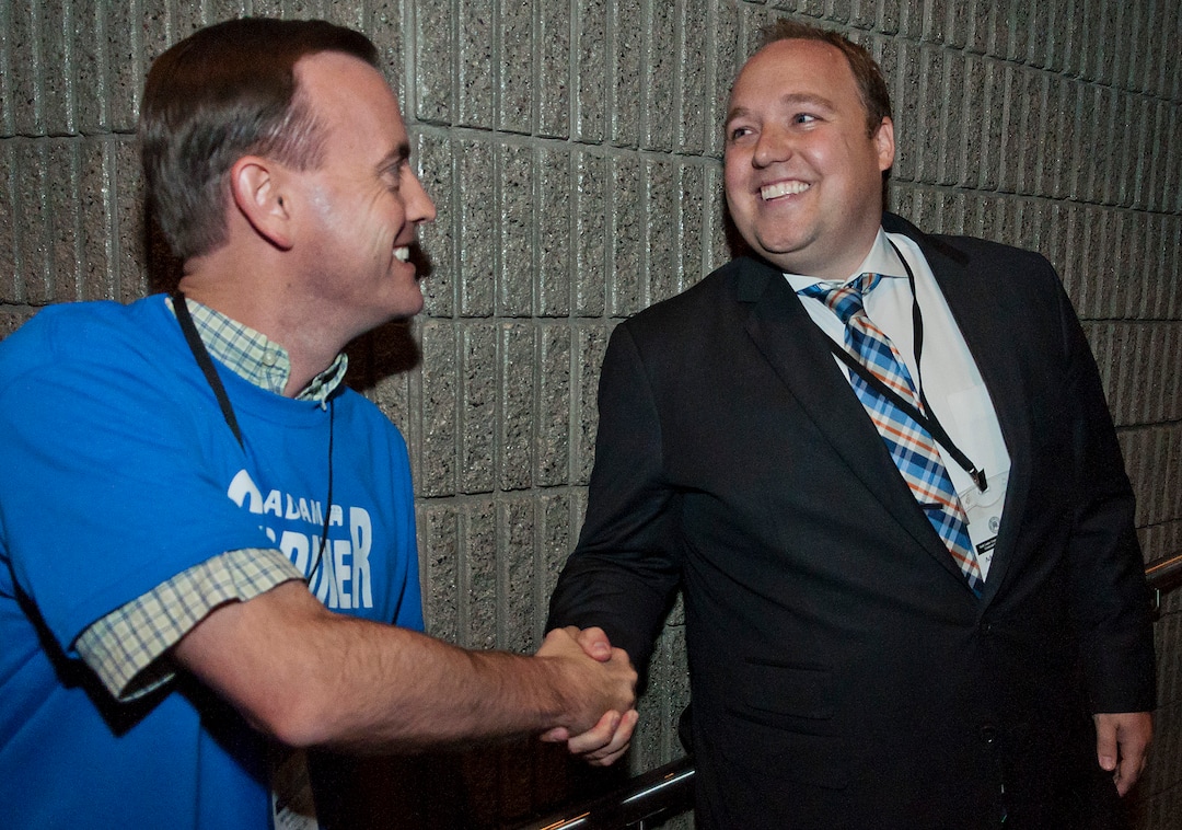 (Michael Mangum  |  Special to the Tribune)  Rep. Mike Winder of West Valley City, left, congratulates Adam Gardiner after learning he won the election for Salt Lake county recorder at the county republican Central Committee Meeting at Jordan High School in Sandy, UT on Thursday, August 17, 2017.