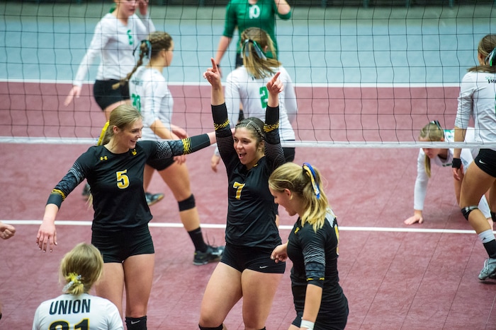 (Chris Detrick  |  The Salt Lake Tribune)  Union's Taylor Rundell (5) Union's Marleigh Harrocks (7) and Union's Aislynn Weaver (4) celebrate wining a point during the 3A volleyball state quarterfinals at the UCCU Center at Utah Valley University Wednesday, October 25, 2017.  