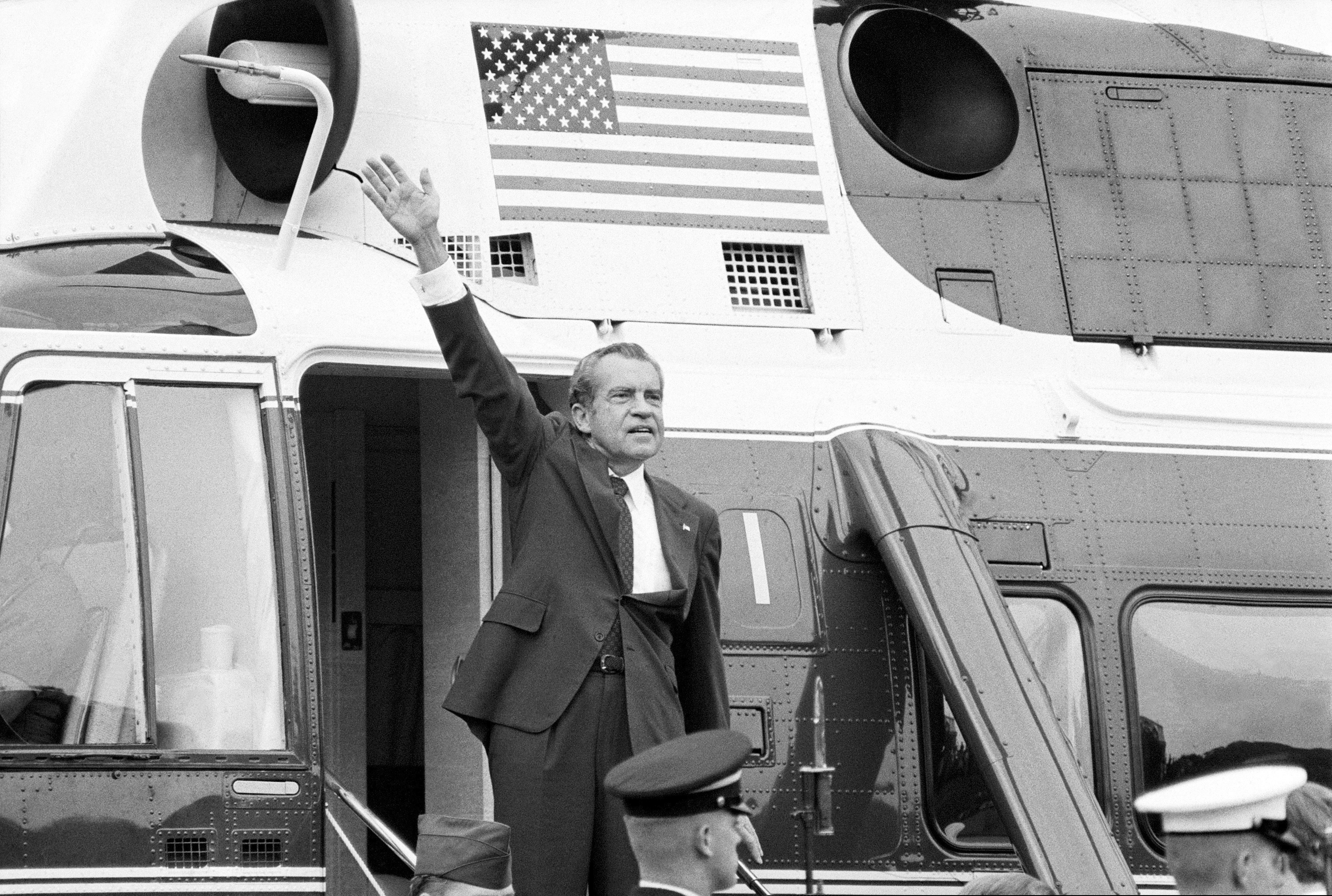 (Chick Harrity | AP file photo) President Richard Nixon waves goodbye from the steps of his helicopter outside the White House, after he gave a farewell address to members of the White House staff on Aug. 9, 1974. Nixon was taken to nearby Andrews Air Force Base where he boarded Air Force One for a flight to California. On Aug. 7, 1974, three top Republican leaders in Congress paid a solemn visit to Nixon at the White House, bearing the message that he faced near-certain impeachment due to eroding support in his own party on Capitol Hill. Nixon, who’d been entangled in the Watergate scandal for two years, announced his resignation the next day.