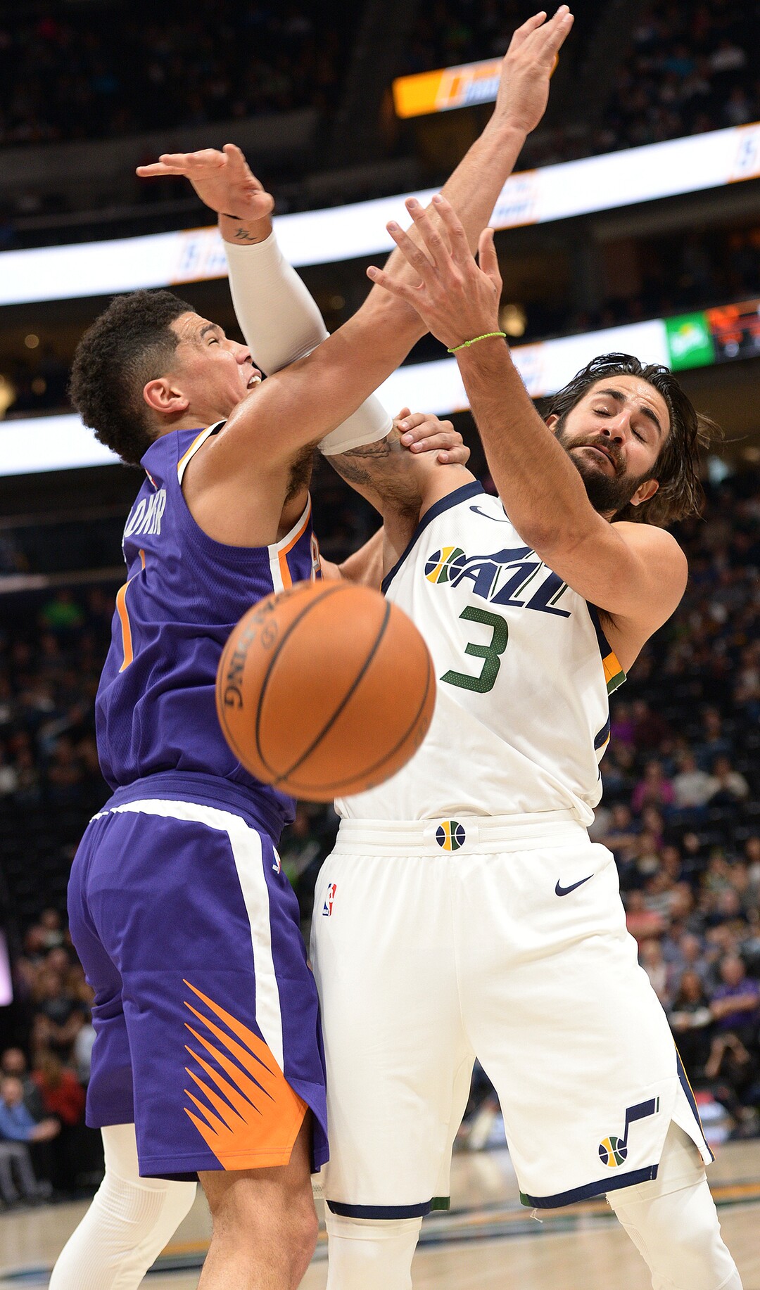 (Leah Hogsten  |  The Salt Lake Tribune) Utah Jazz guard Ricky Rubio (3) tangles with Phoenix Suns guard Devin Booker (1).  The Utah Jazz defeated the Phoenix Suns 112-101 during preseason NBA basketball at Vivint Smart Home Arena in Salt Lake City, October 6, 2017.