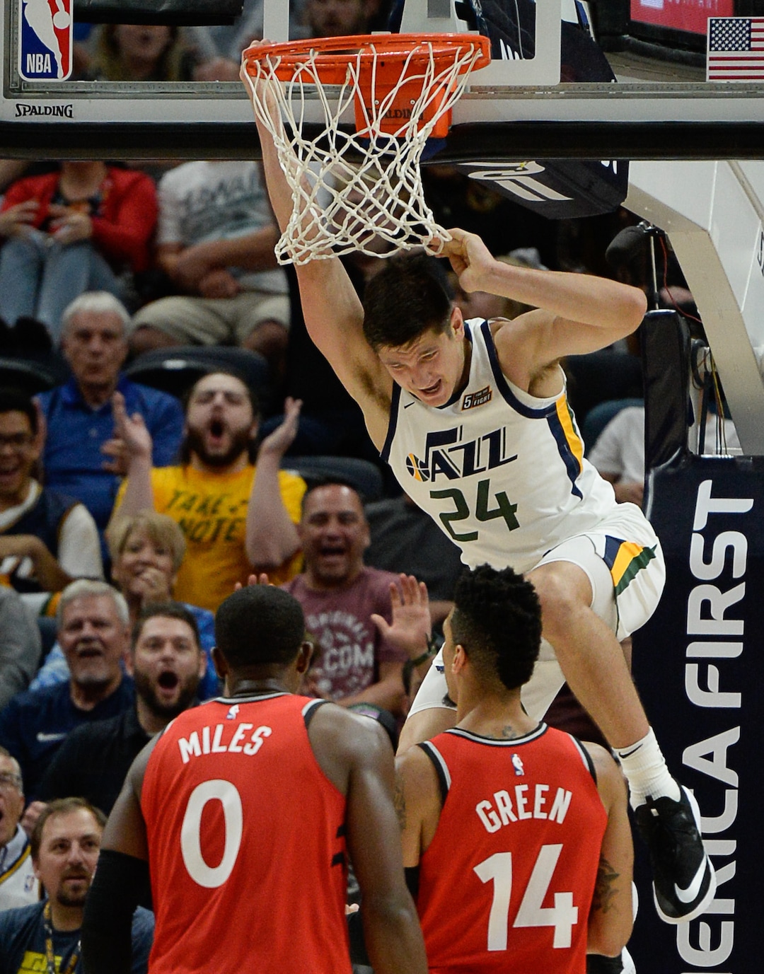 (Francisco Kjolseth  |  The Salt Lake Tribune)  Utah Jazz guard Grayson Allen (24) hangs on the rim after a dunk with an assist from Utah Jazz forward Royce O'Neale (23) in the second half of the preseason NBA game at Vivint Smart Home Arena Tuesday, Oct. 2, 2018, in Salt Lake City against the Raptors.