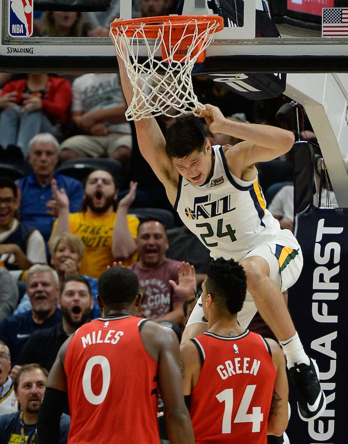 (Francisco Kjolseth  |  The Salt Lake Tribune)  Utah Jazz guard Grayson Allen (24) hangs on the rim after a dunk with an assist from Utah Jazz forward Royce O'Neale (23) in the second half of the preseason NBA game at Vivint Smart Home Arena Tuesday, Oct. 2, 2018, in Salt Lake City against the Raptors.