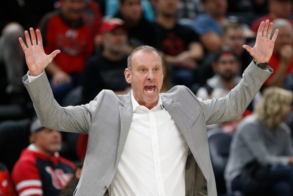 Utah head coach Larry Krystkowiak shouts to his team in the first half during an NCAA college basketball game against Weber State Saturday, Dec. 14, 2019, in Salt Lake City. (AP Photo/Rick Bowmer)