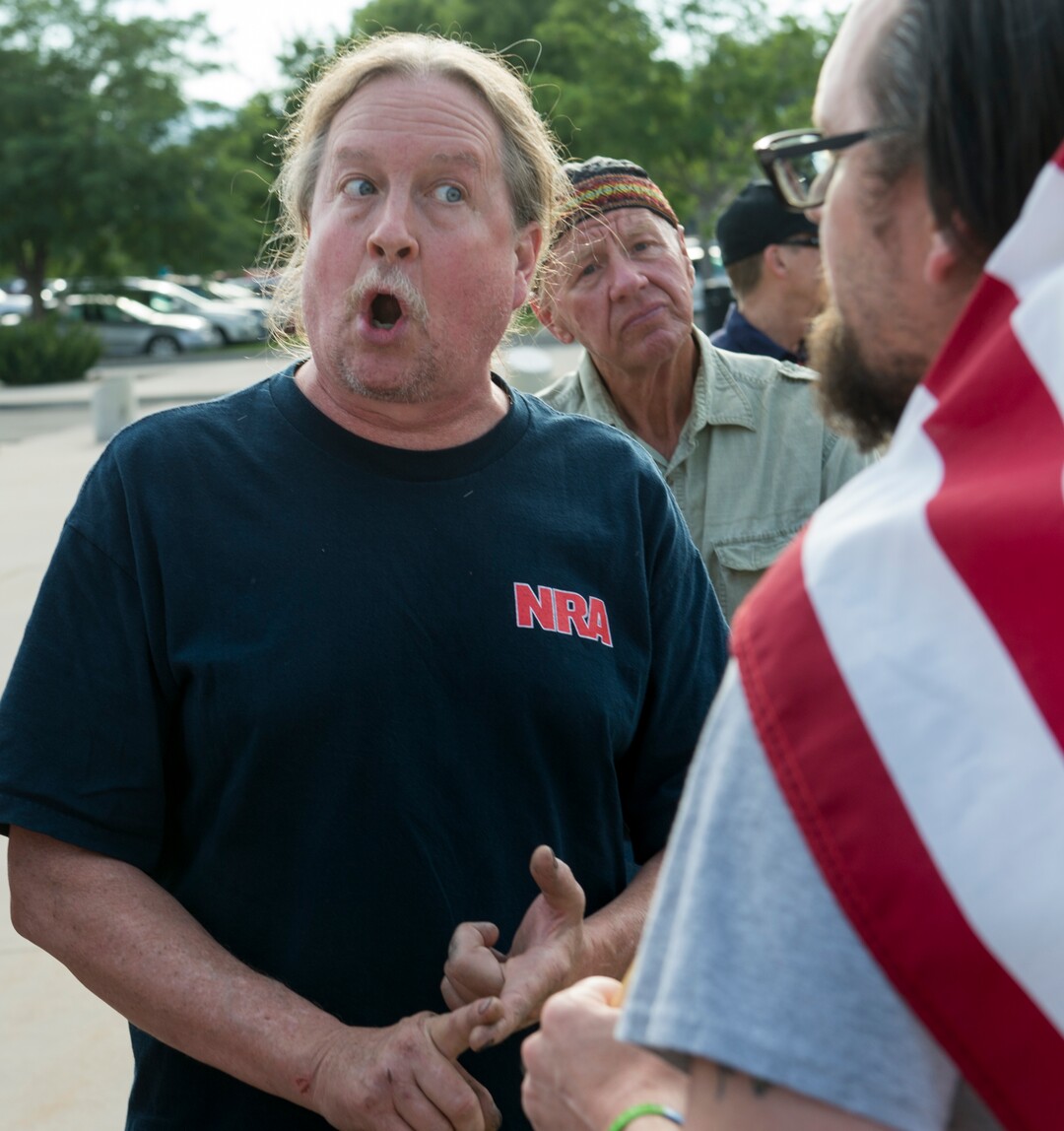 (Rick Egan  |  The Salt Lake Tribune)      Mark Stewart  talks about his views on guns, as Joshua Cameron listens, before a town hall meeting in Sandy, where survivors from the Florida school shooting held a forum with Utah students involved with the March for Our Lives movement, Saturday, July 14, 2018.