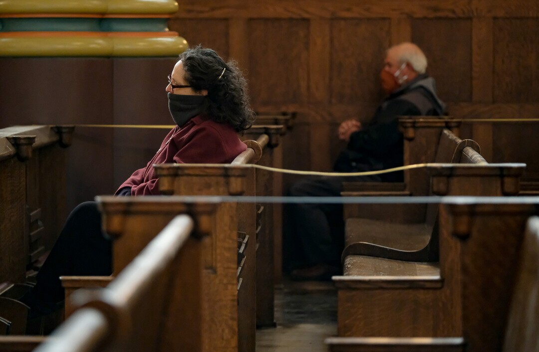 (Francisco Kjolseth  |  The Salt Lake Tribune) Catholic parishioners observe morning daily Mass at Cathedral of the Madeleine in Salt Lake City on Friday, May 8, 2020, where a majority of the pews are taped off due to restrictions implemented to combat COVID-19.