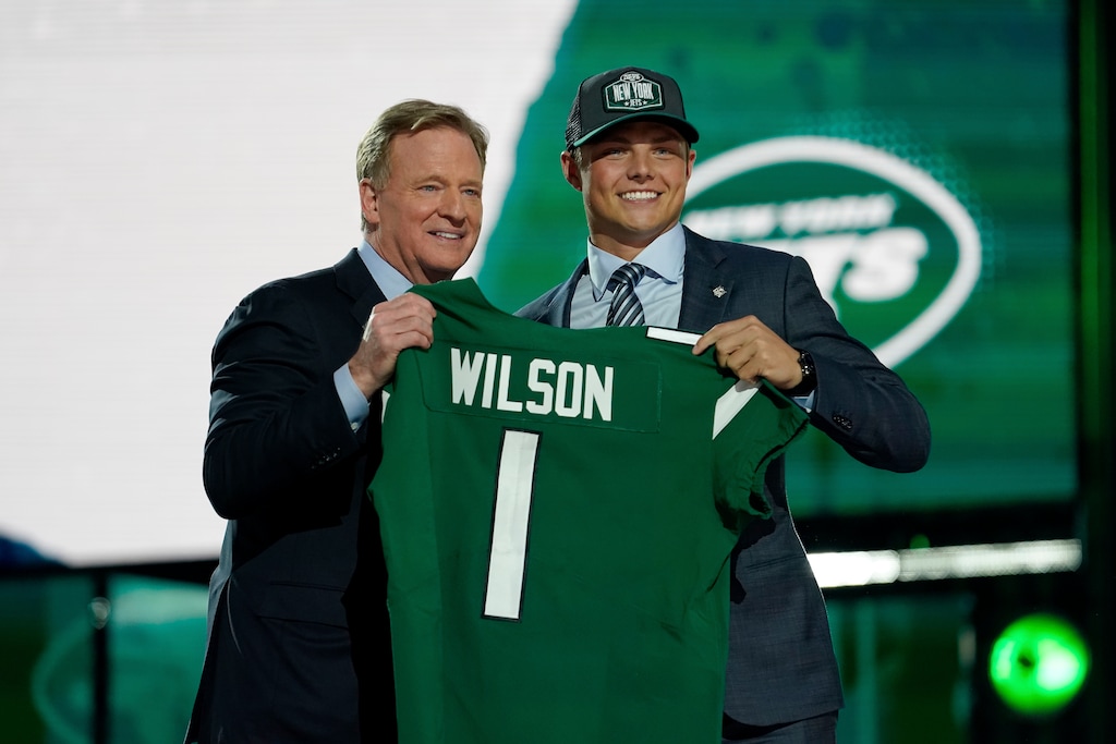 (Steve Luciano | AP) BYU quarterback Zach Wilson, right, poses for a photo with NFL Commissioner Roger Goodell after being drafted by the New York Jets in the first round of the NFL football draft, Thursday, April 29, 2021, in Cleveland.