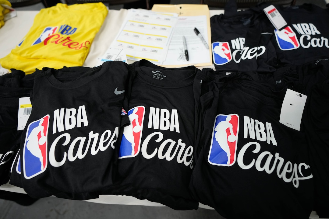 (Francisco Kjolseth | The Salt Lake Tribune) Hundreds of NBA volunteers, including current players, legends, partners and guests help pack boxes with food during the NBA Cares Day of Service in Salt Lake City on Feb. 17, 2023.