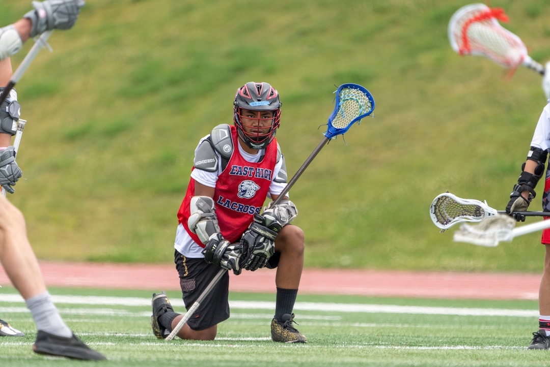 (Rick Egan | The Salt Lake Tribune)  Lolo Angilau watches the action as he takes a break, in East youth lacrosse practice, on Wednesday, June 22, 2022.
