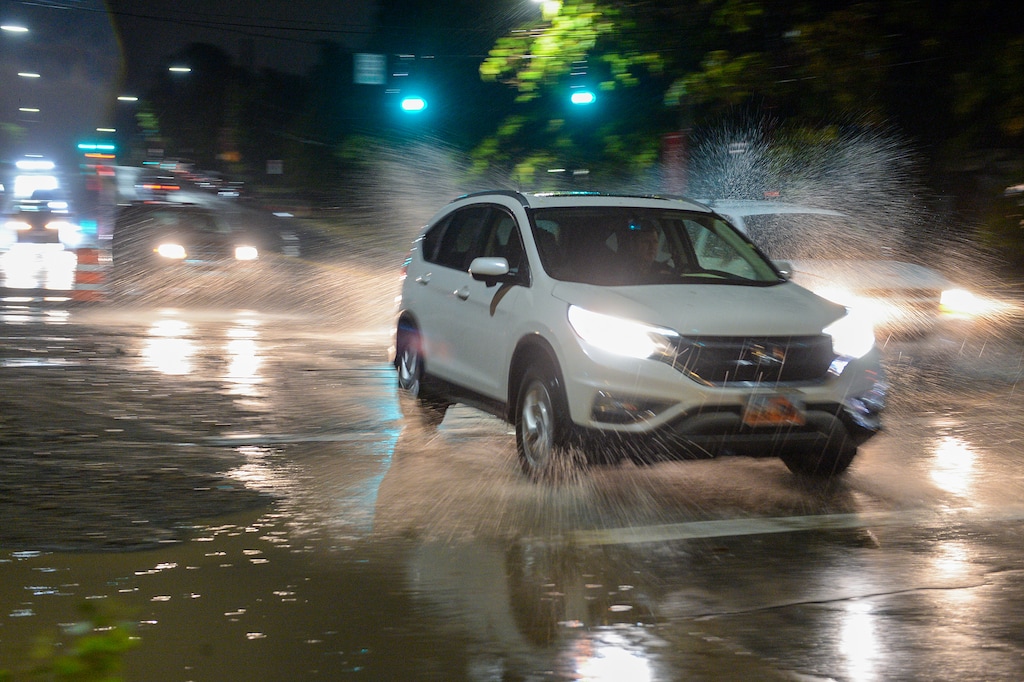 (Chris Samuels | The Salt Lake Tribune) Flooding in Salt Lake City caused debris to cover the road at 100 South and 1300 East after heavy rains, Sunday, Aug. 1, 2021.