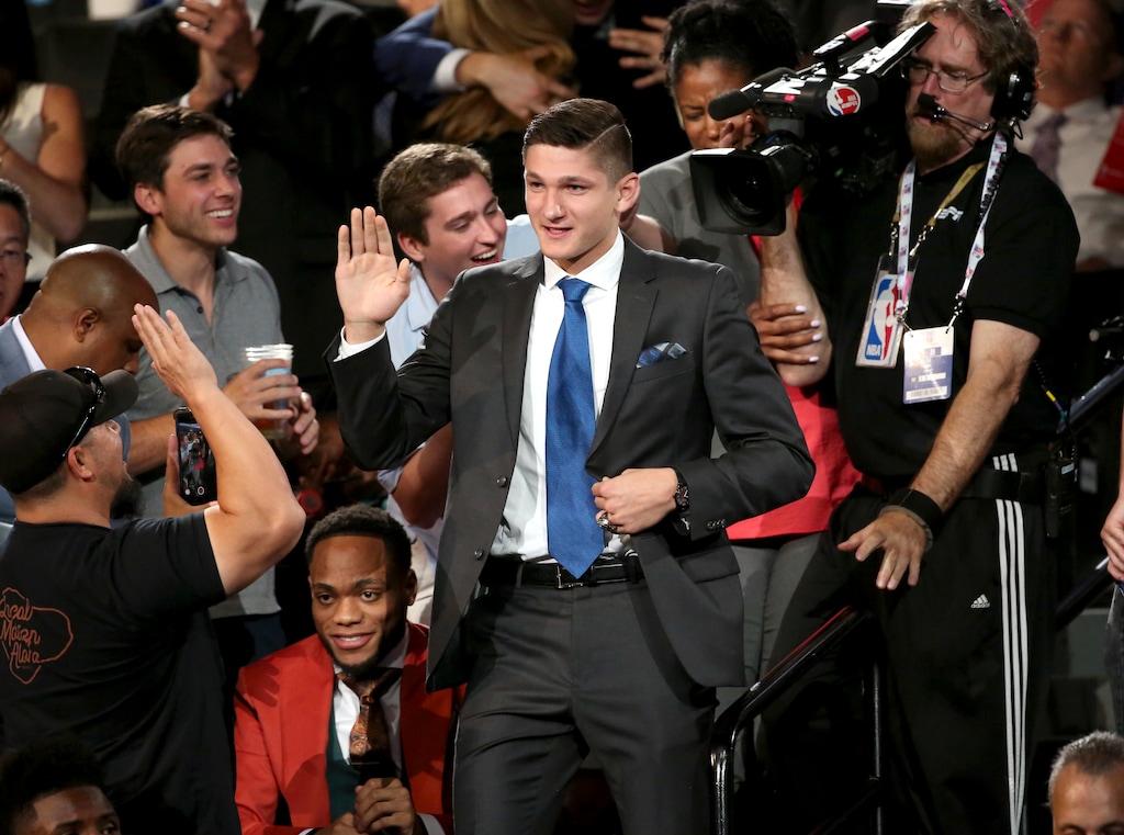Duke's Grayson Allen makes his way to the stage after he was picked 21st overall by the Utah Jazz during the NBA basketball draft in New York, Thursday, June 21, 2018. (AP Photo/Kevin Hagen)