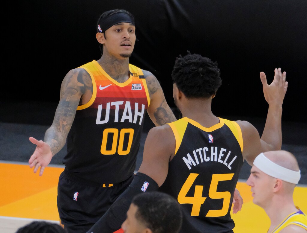 (Leah Hogsten | The Salt Lake Tribune) Utah Jazz guard Jordan Clarkson (00) and Utah Jazz guard Donovan Mitchell (45) celebrate play as the Utah Jazz take on the L.A. Lakers, Feb. 24, 2021 at Vivint Arena. 
