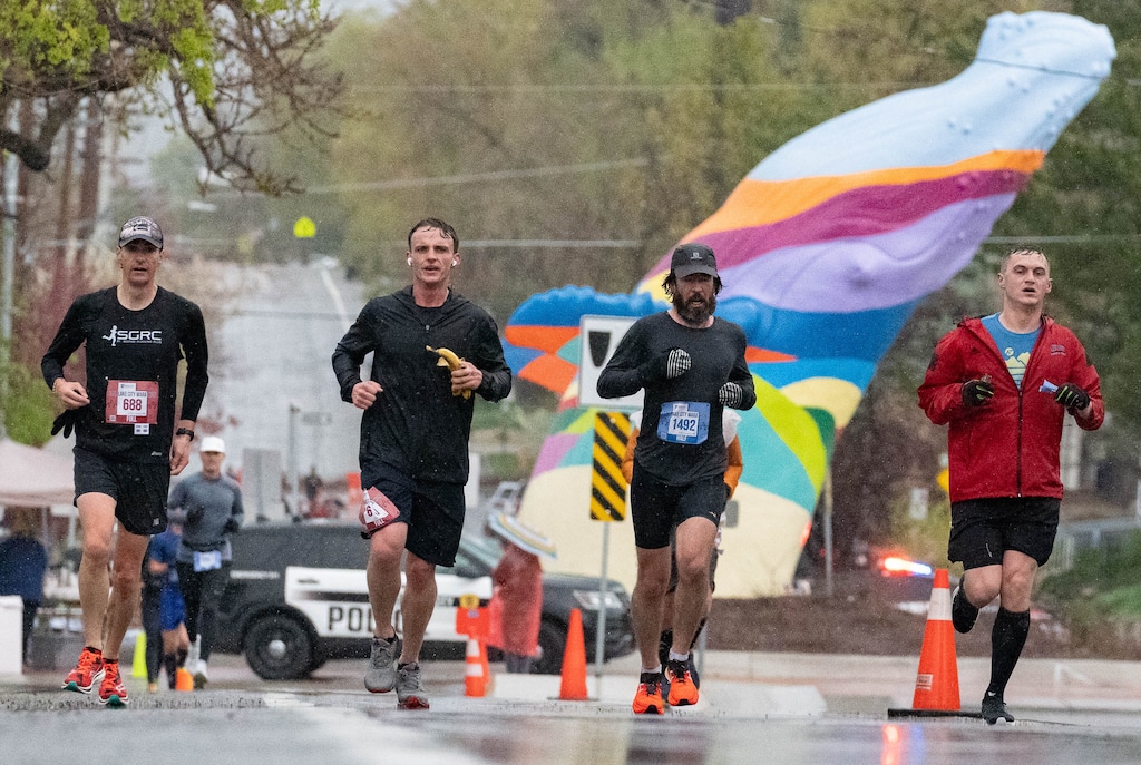 (Francisco Kjolseth | The Salt Lake Tribune) Weather indicative of the Pacific Northwest makes a breaching whale seem more appropriate as runners endure cold wet conditions as they participate in the Salt Lake City Marathon on Saturday, April 23, 2022. Temperatures are expected to drop into the 30s on Thursday night, bringing a chance of rain mixed with snow.