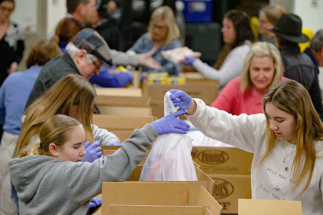 (Francisco Kjolseth  |  The Salt Lake Tribune) The community comes together during the coronavirus outbreak on Saturday, March 14, 2020, after hearing the Utah Food Bank is hurting for volunteers, since groups that normally volunteer canceled after the order of mass gatherings.