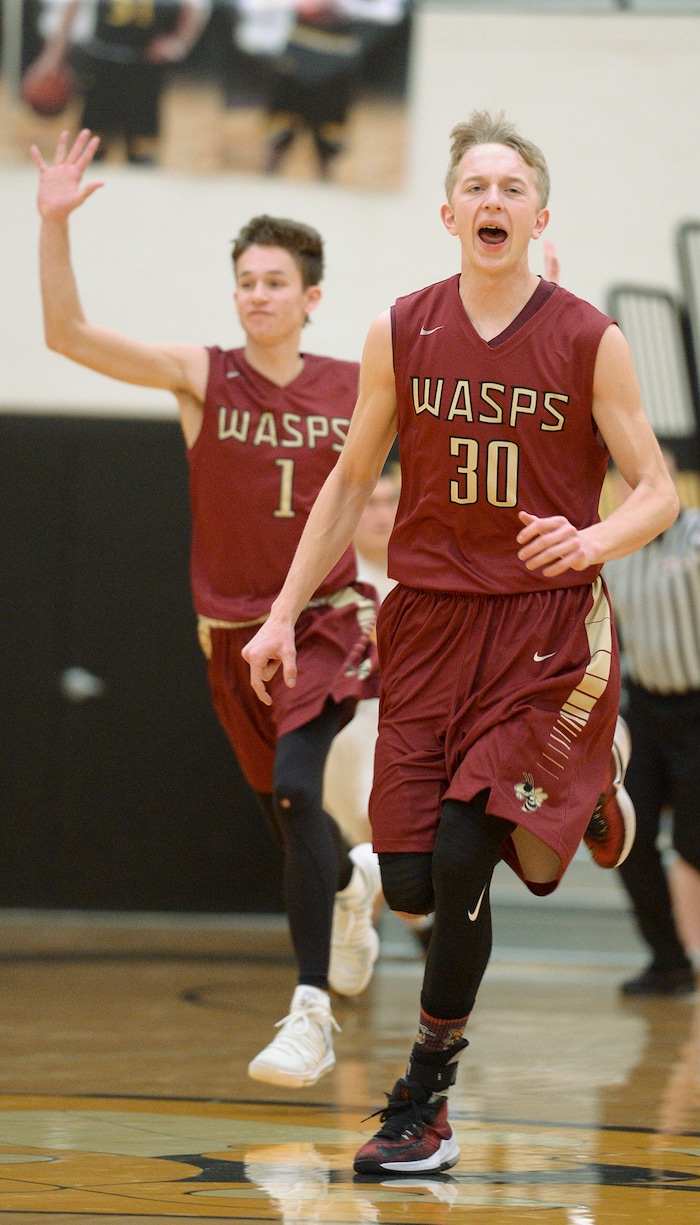 (Leah Hogsten  |  The Salt Lake Tribune) Juab's Kollin Robertson and Macray Stevens celebrate a bucket. Juab High School boys' basketball team defeated Summit Academy 61-58 during their 3A State tournament game in Heber  Saturday, Feb. 16, 2018.
