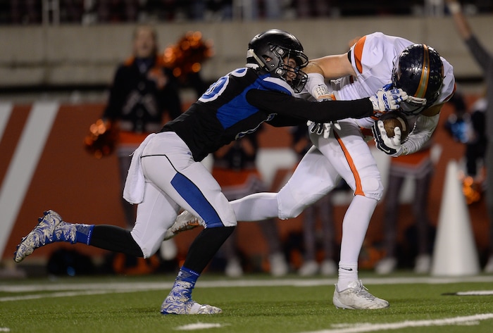 (Francisco Kjolseth  |  The Salt Lake Tribune)  Cooper Roudy of Stansbury puts pressure on Nicholas Nerhercott of Mountain Crest in their class 4A semifinal game at Rice-Eccles Stadium, Thursday, Nov. 9, 2017.