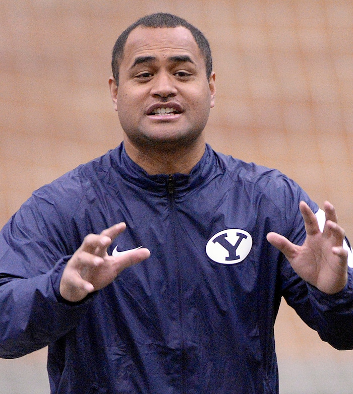 Al Hartmann  |  The Salt Lake Tribune
BYU's new running back coach Reno Mahe works with his players during practice Tuesday March 22.  