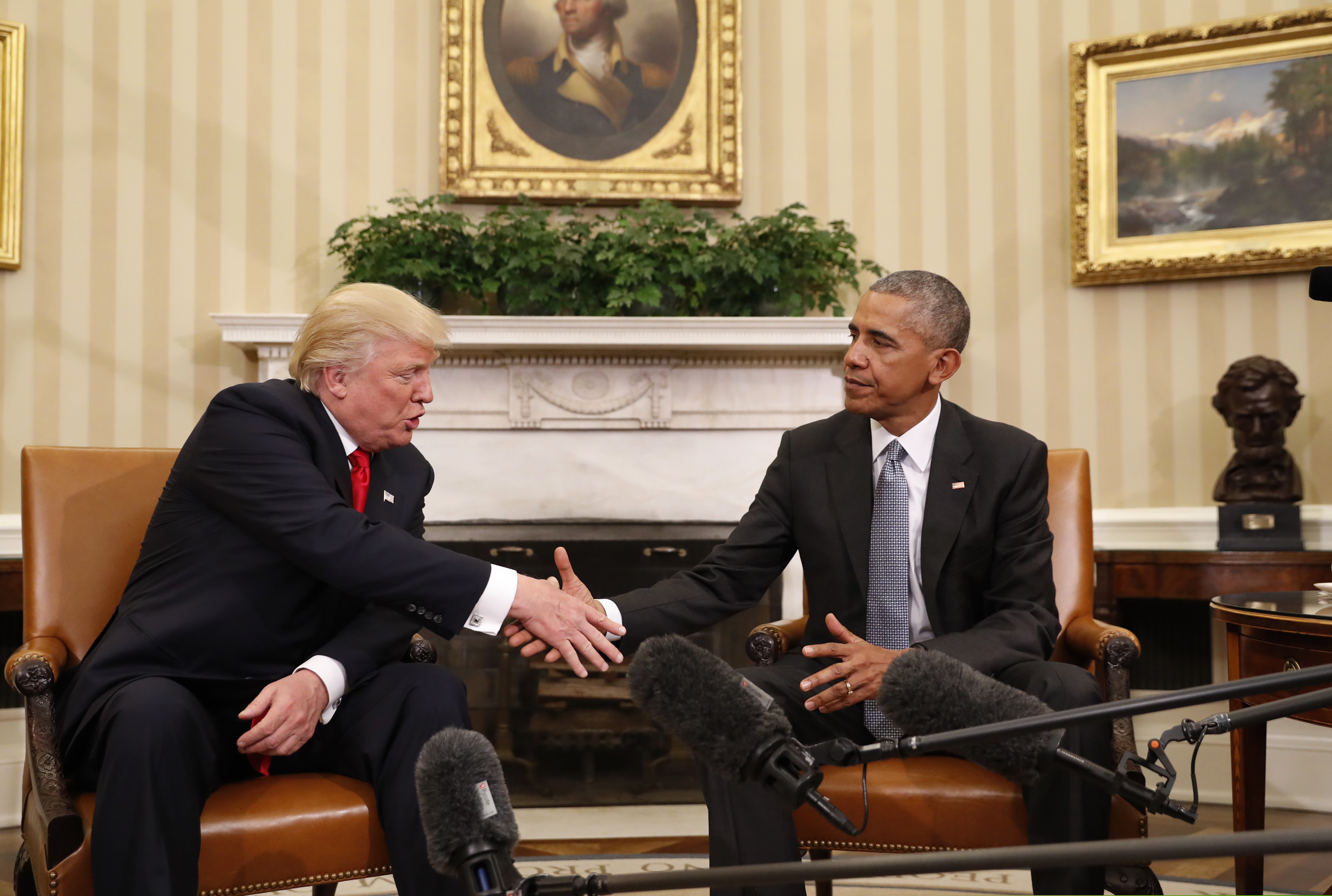(Pablo Martinez Monsivais | AP file photo)  President Barack Obama shakes hands with President-elect Donald Trump in the Oval Office of the White House in Washington, Thursday, Nov. 10, 2016. President Trump and his allies are harking back to his own transition four years ago to make a false argument that his own presidency was denied a fair chance for a clean launch. Press secretary Kayleigh McEnany laid out the case from the White House podium last week. Obama, who had portrayed Trump as an existential threat to the nation, invited the president-elect to the White House and visited with him in the Oval Office. Obama's aides also offered help to Trump's incoming staffers.