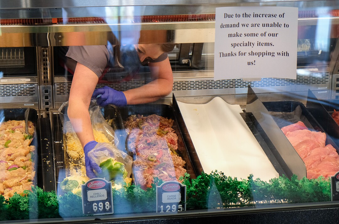 (Francisco Kjolseth  |  The Salt Lake Tribune) A steady stream of customers visits Snider Brothers Meats in Cottonwood Heights on Tuesday, May 5, 2020, where owners Will and Amy Wilson, have been requiring that all customers wear masks or facial coverings when they come to shop. A sign points out the lack of some specialty items due to the demand created by the coronavirus pandemic.