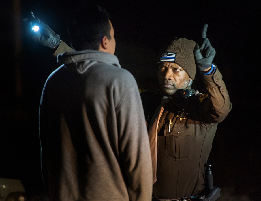 (Rick Egan  |  Tribune file photo)     Utah Highway Patrol Trooper Daud Eftin and Trooper Kelley Jensen give a field sobriety test during a DUI blitz on New Year's Eve.  The subject was released after passing the test. Monday, Dec. 31, 2018.