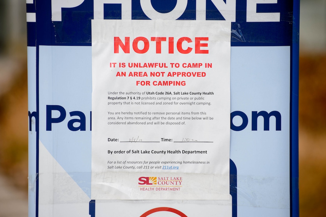 (Trent Nelson | The Salt Lake Tribune) A posted notice by the Salt Lake County Health Department prohibiting camping near the Salt Lake City Library on Tuesday, Nov. 19, 2019.