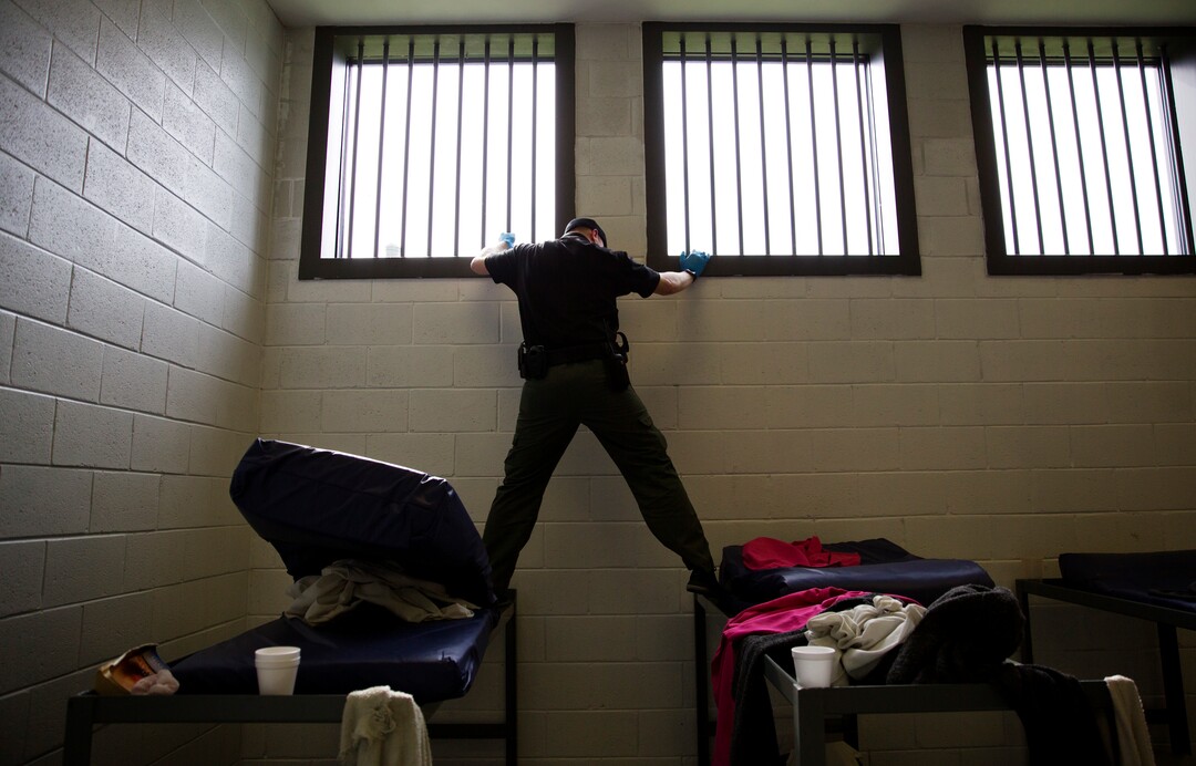 A correctional officer searches a cell on suspicion that meth was sneaked into the Campbell County Jail in Jacksboro, Tenn., Wednesday, March 28, 2018. Many of the inmates are addicts. Of the charges landing women in the county jail, 85-to-90 percent are drug-related. The women receive no counseling. Then weeks, months or years later, they're released into the same community where friends _ and in some cases, family _ are using drugs. Soon they are again, too. (AP Photo/David Goldman)