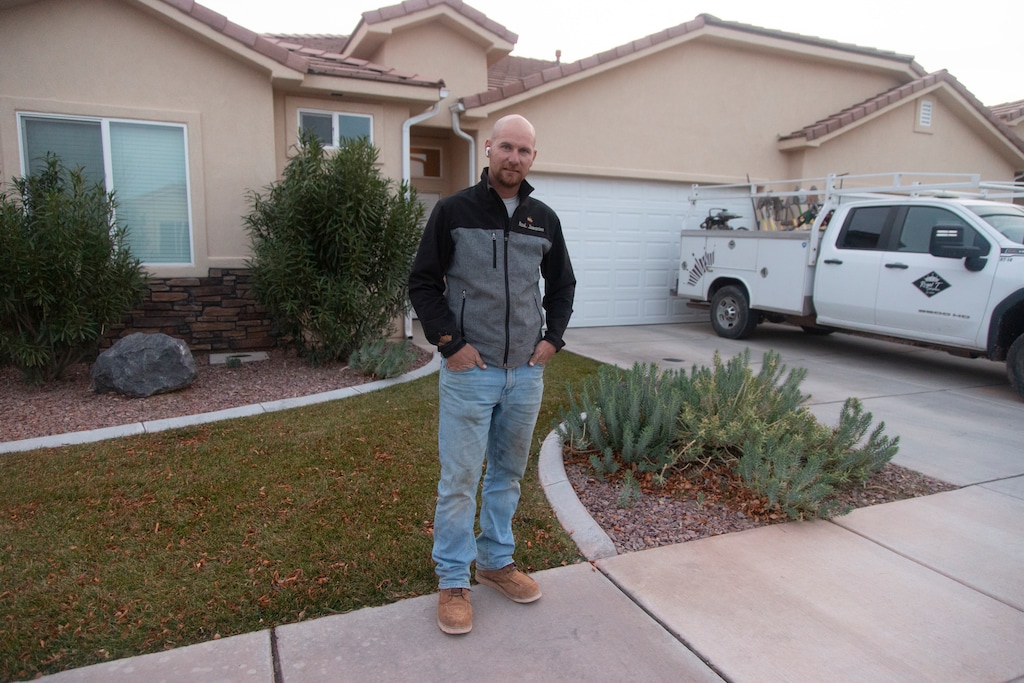 (Chris Caldwell | Special to The Tribune) Gavin Johnson in front of his rented townhome in Hurricane, Tuesday, Dec. 30, 2025. Johnson, like many others have found difficulty making the jump from renting to buying a house for his family in the local housing market.