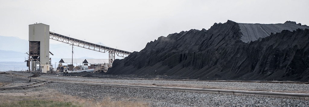 (Francisco Kjolseth | Tribune file photo) Utah-mined coal is piled up at the Levan transfer facility along Interstate 15, south of Nephi, where it is loaded on trains bound for California for shipment oversees. Four Utah counties are preparing to invest up to $53 million of state money in a proposed bulk-loading marine terminal proposed on the San Francisco Bay. Their goal is to sell more Utah coal to Japan, but the Oakland project is mired in controversy and lawsuits.