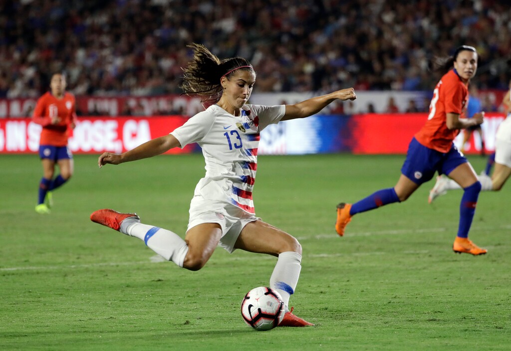 FILE - In this Aug. 31, 2018, file photo, United States' Alex Morgan takes a shot on goal against Chile during the first half of an international friendly soccer match, in Carson, Calif. Morgan, who had 18 goals in 19 games this year to lead the national team, has been named U.S. Soccer’s Player of the Year.(AP Photo/Marcio Jose Sanchez, File)