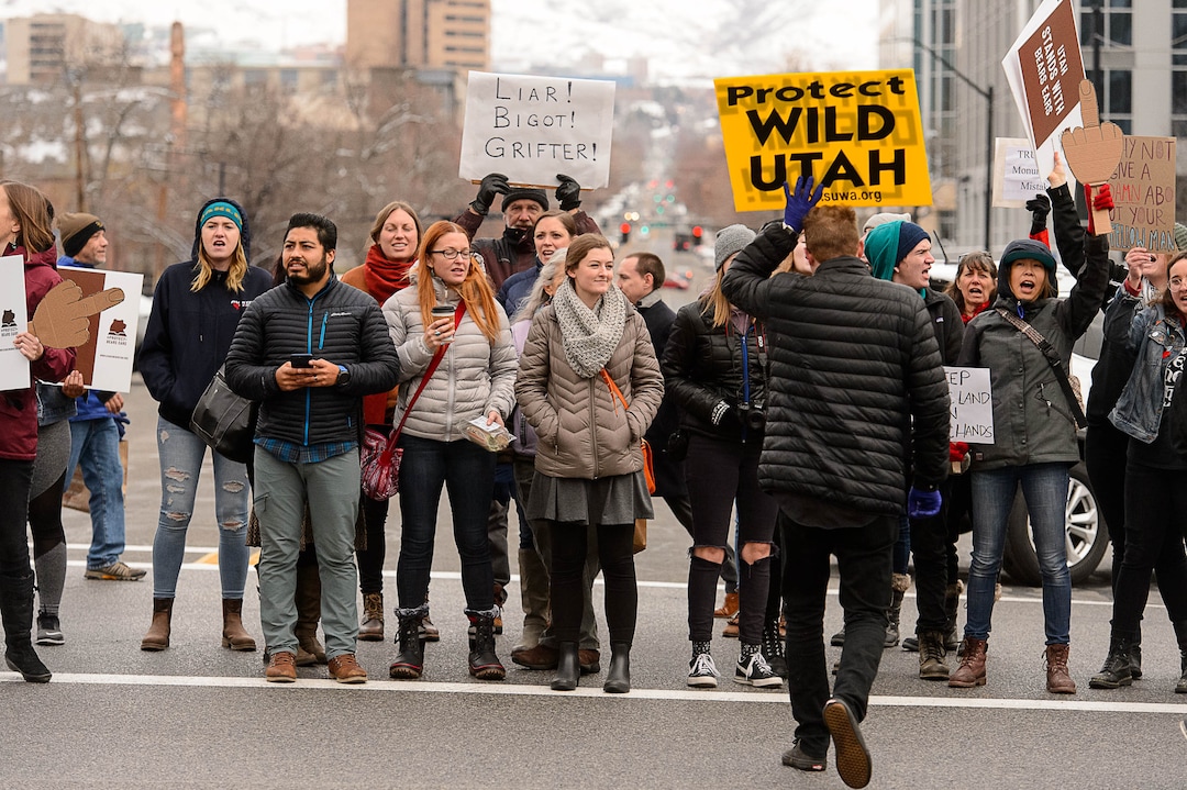 (Trent Nelson | The Salt Lake Tribune)  Protesters block off an intersection downtown after a rally against a visit by President Donald Trump, Monday December 4, 2017.