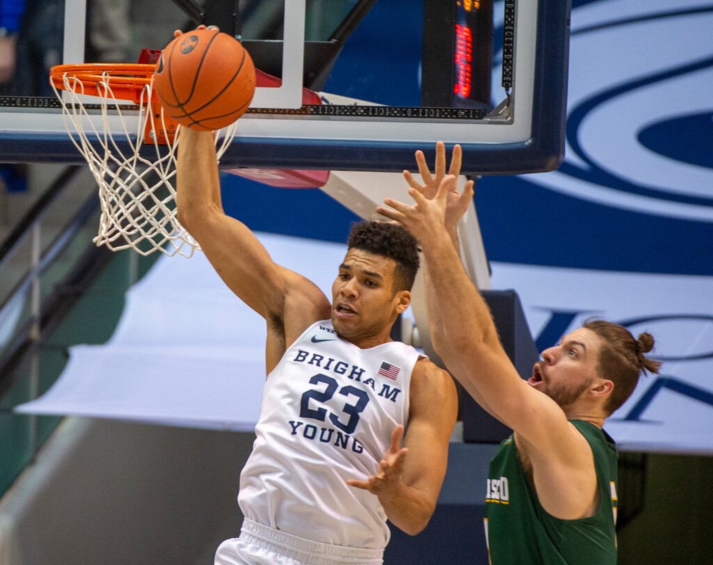 (Rick Egan  |  The Salt Lake Tribune)   Brigham Young Cougars forward Yoeli Childs (23) grabs a rebound as San Francisco Dons center Jimbo Lull (5) defends, in WCC basketball acton between the Brigham Young Cougars and the San Francisco Dons, at the Marriott Center, Saturday, Feb. 8, 2020.