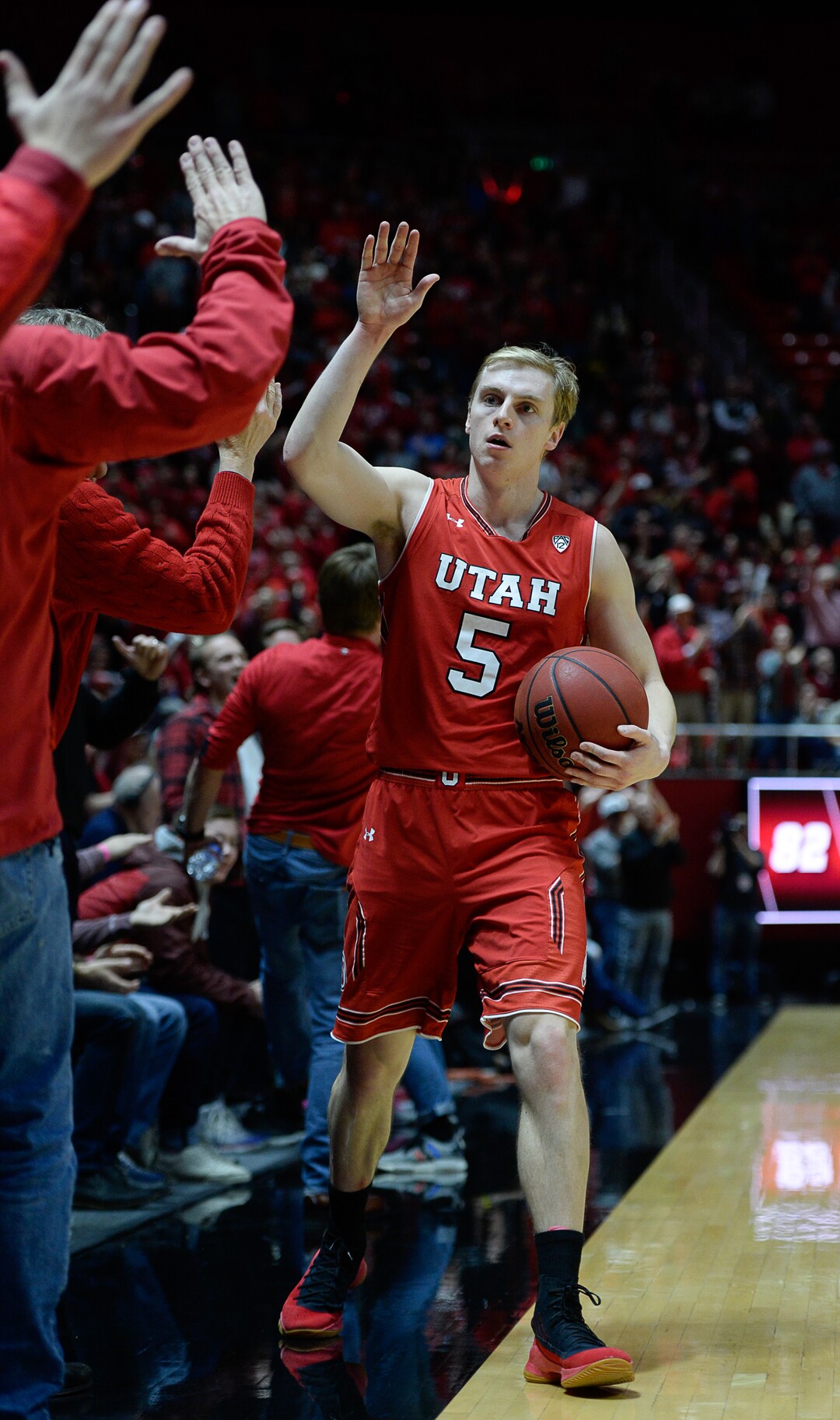 (Francisco Kjolseth  |  The Salt Lake Tribune)  Utah Utes guard Parker Van Dyke (5) celebrates with the fans after playing a critical role in their win over UCLA at the Huntsman Center in Salt Lake City, Thursday, Feb. 22, 2018.