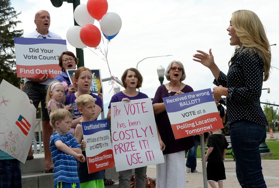 (Al Hartmann  |  The Salt Lake Tribune) Mormon Women for Ethical Government, Salt Lake Indivisible and Action Utah members sing at rally against the confusing process of special election to fill Chaffetz' 3rd District seat outside the historical courthouse in Provo Monday Aug 14. 