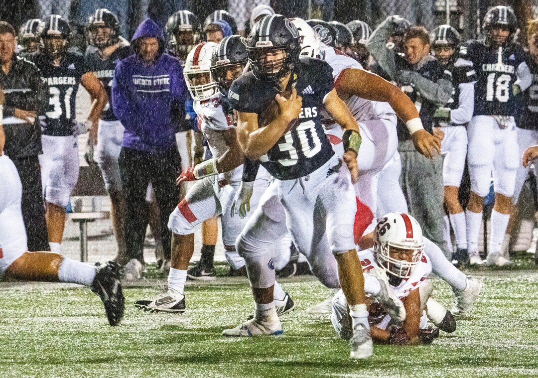 (Rick Egan | The Salt Lake Tribune)  Corner Canyon running back Dylan Carlsen (30) runs the ball for the Chargers, in prep football action between the Corner Canyon Chargers and the East Leopards, on Saturday, Aug. 21, 2021.